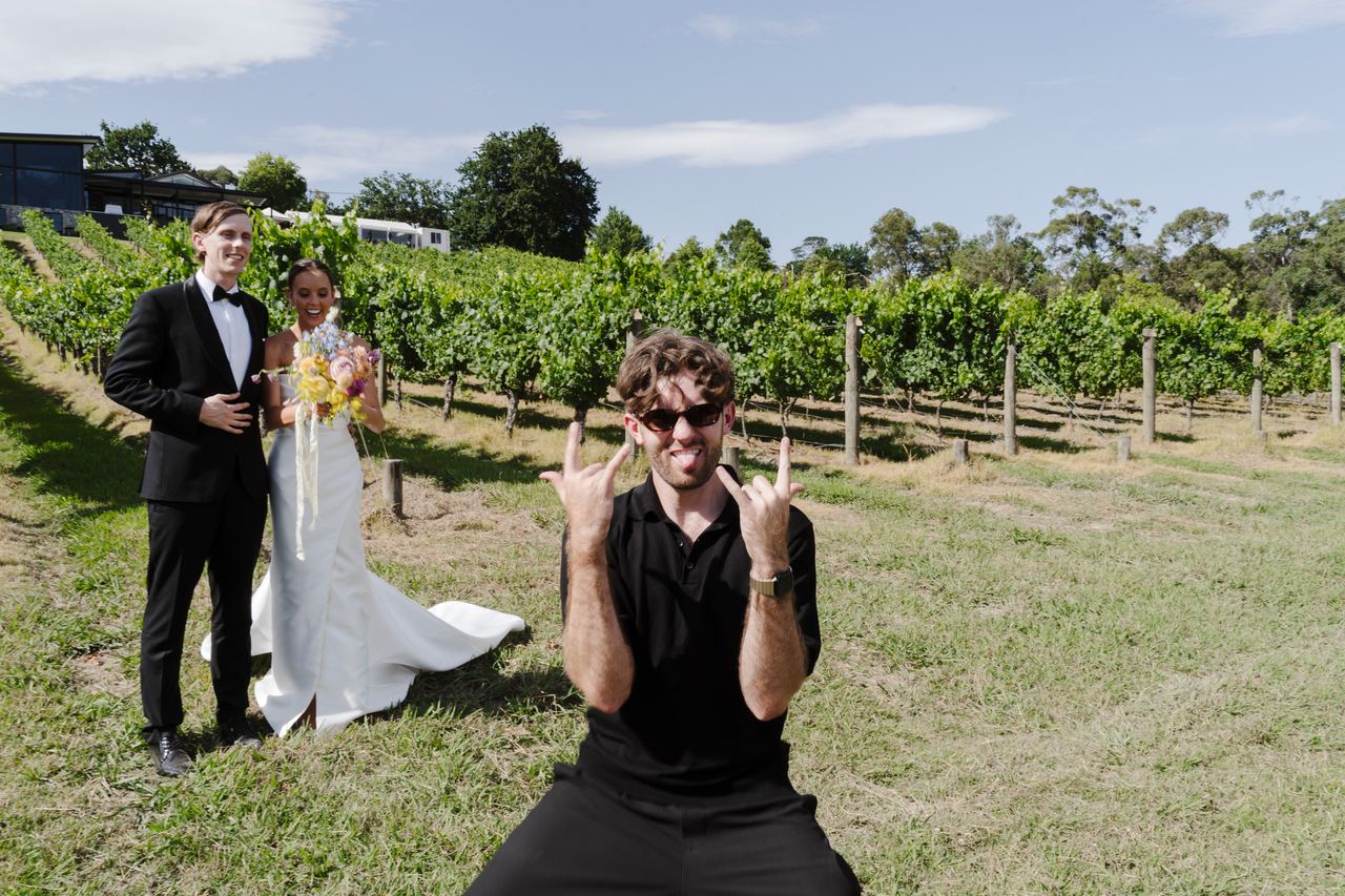 Ethan hamming it up for the camera in front of Matthew and Alex on their wedding day