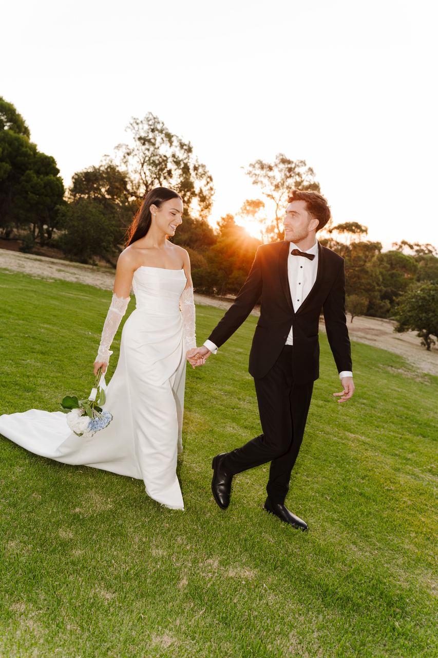 Ben and Cameron laughing as they walk into the sunset