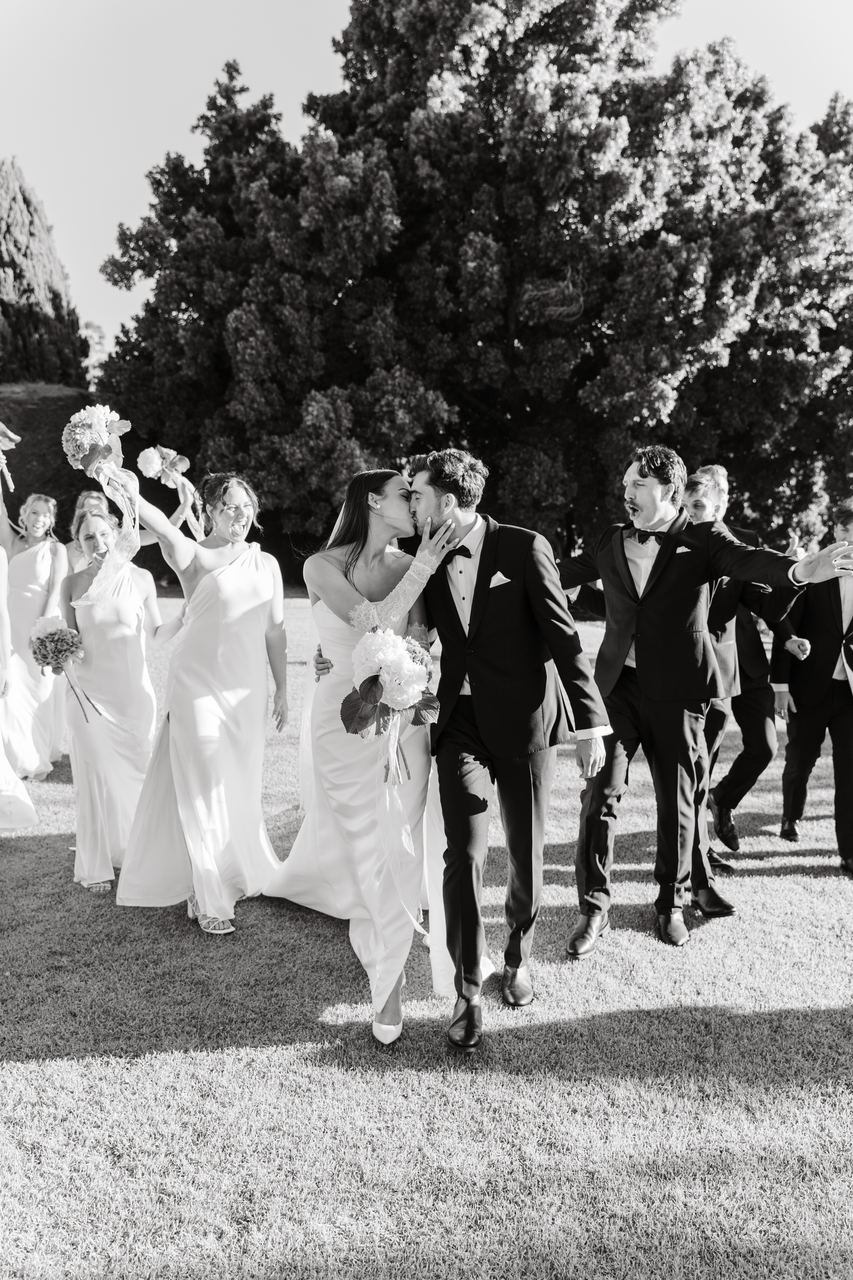 The wedding party walking out together
