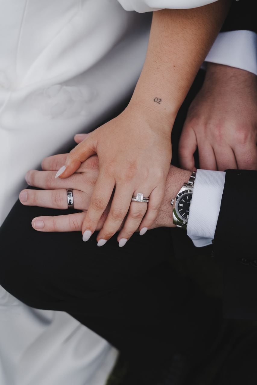 Zak and Zoe's hands, both rings on