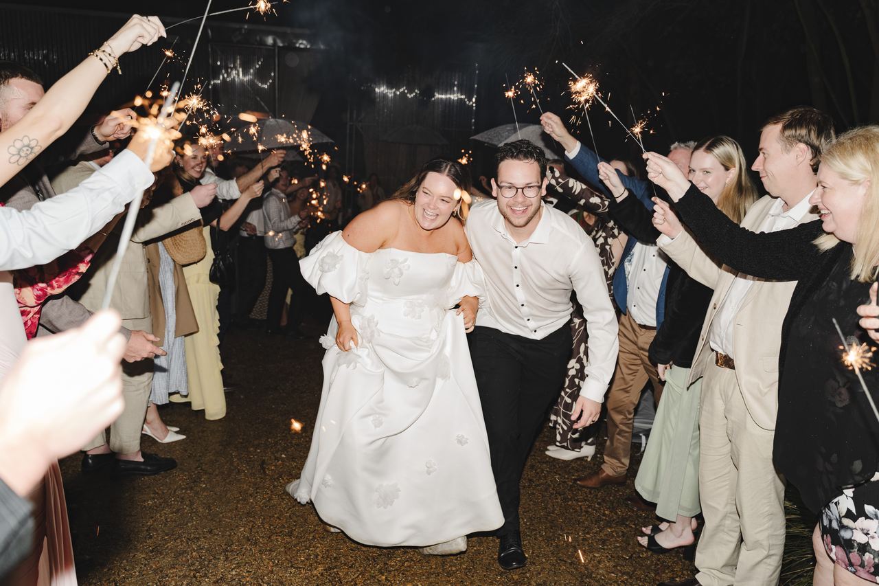 Zak and Zoe running out under the sparklers
