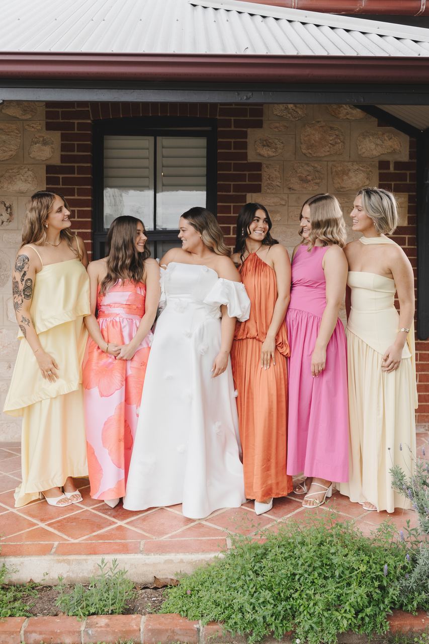 The bridesmaids gathered on the verandah in colour