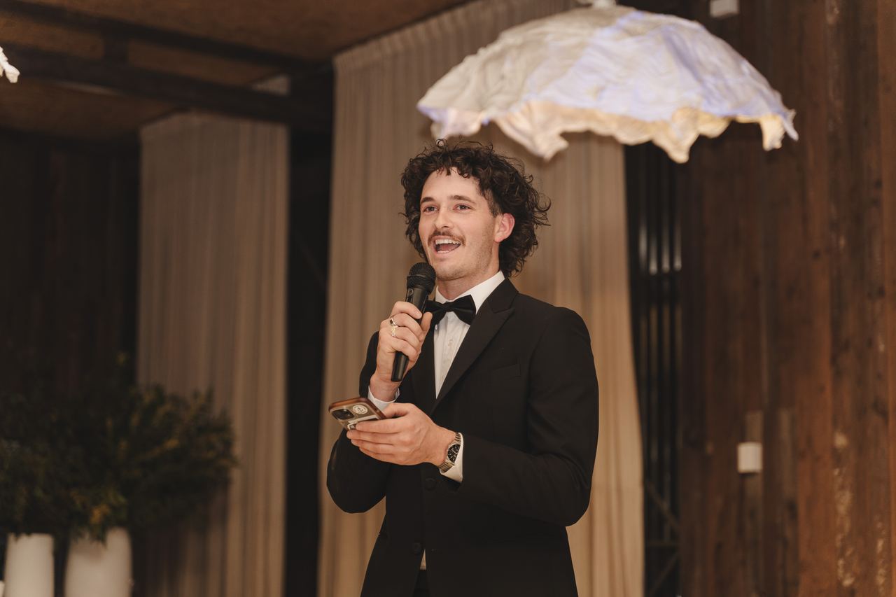 A groomsman giving his speech