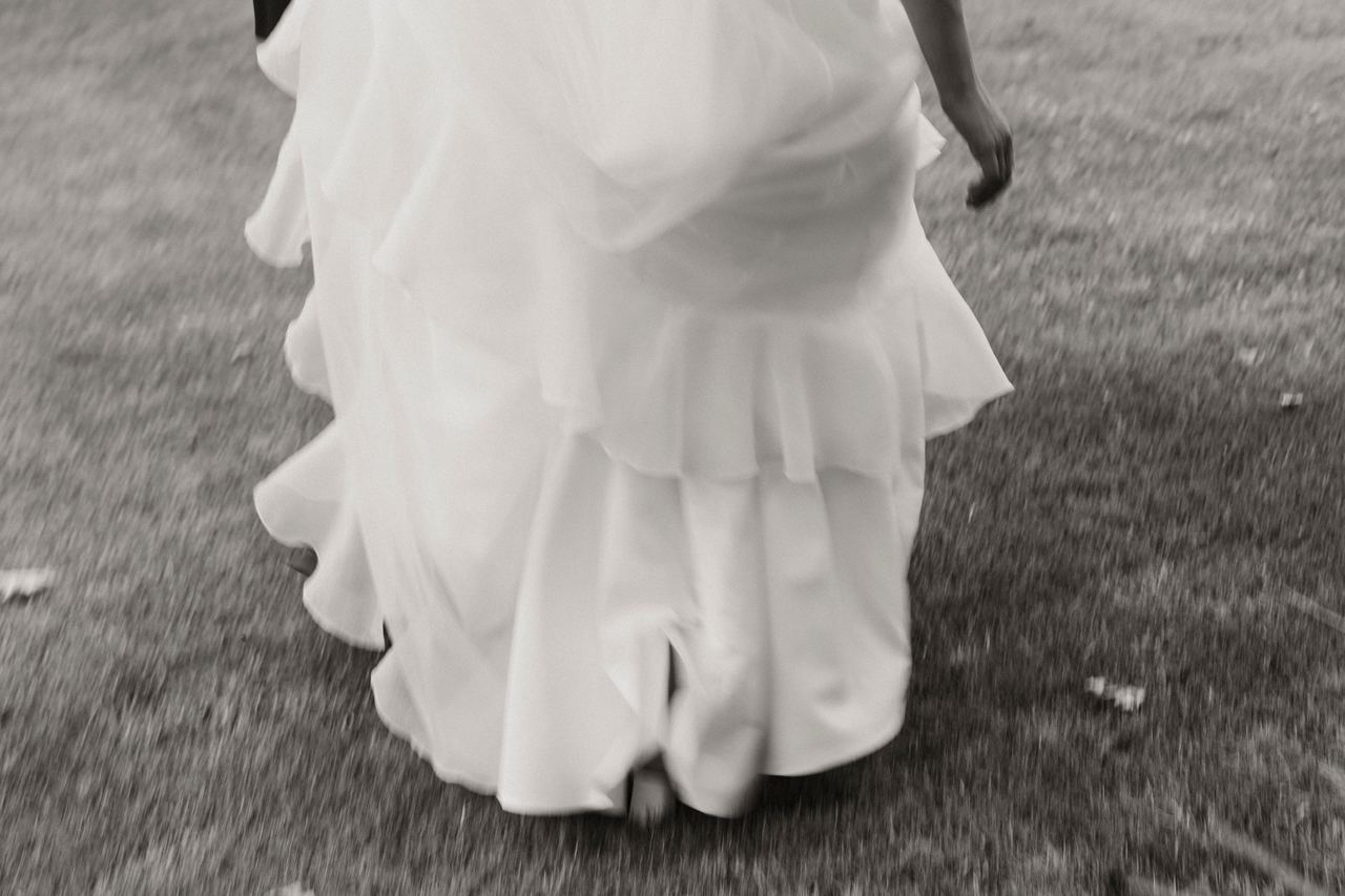 Lily's dress in motion as she walks across the lawn