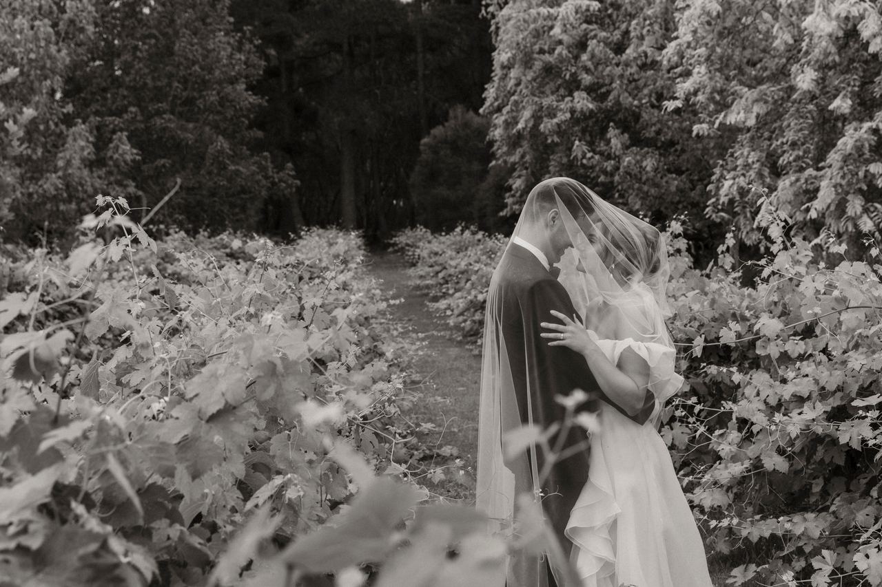 Jason and Lily beneath the veil
