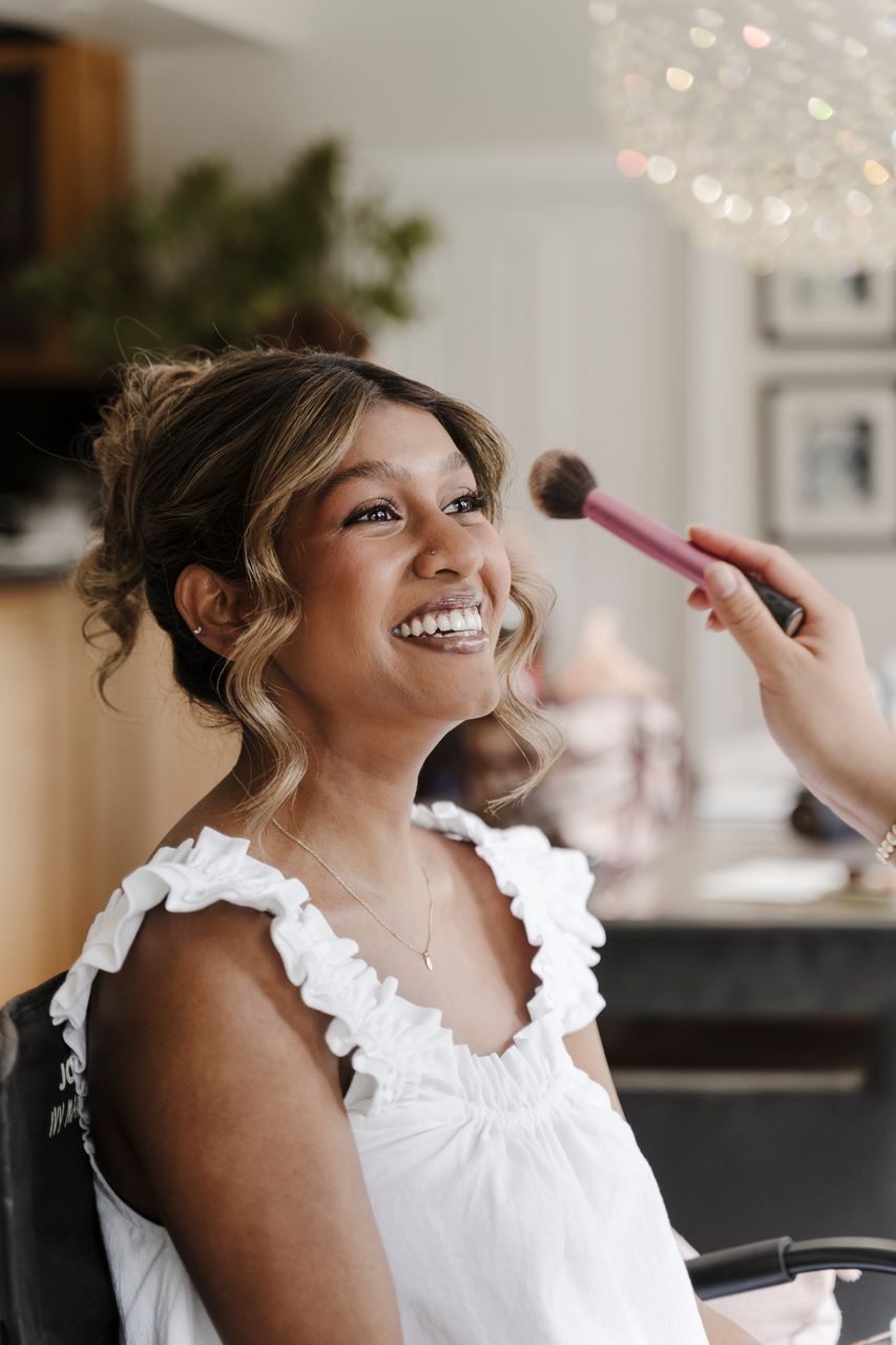 Sinead laughing as the makeup is finished