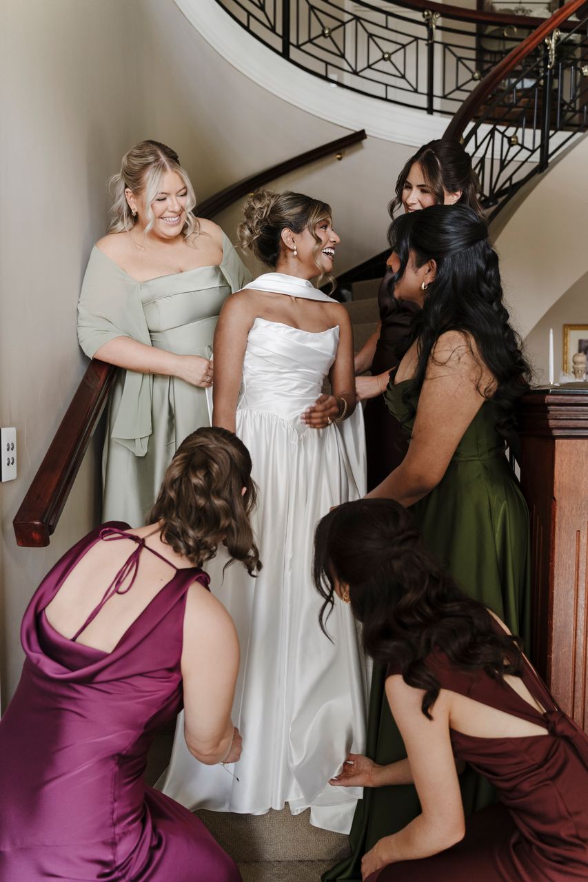 Sinead with the bridesmaids on the staircase