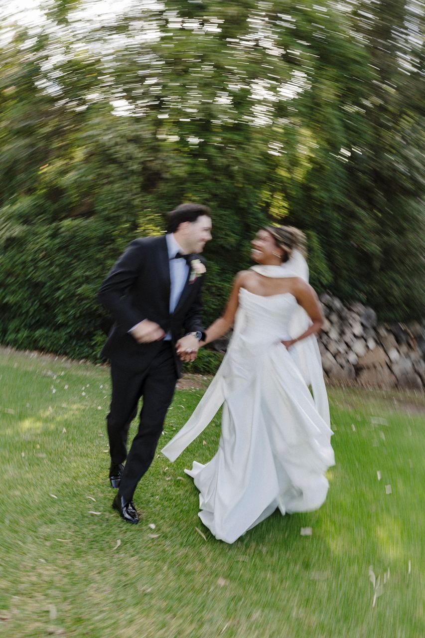 Ben and Sinead dancing across the lawn