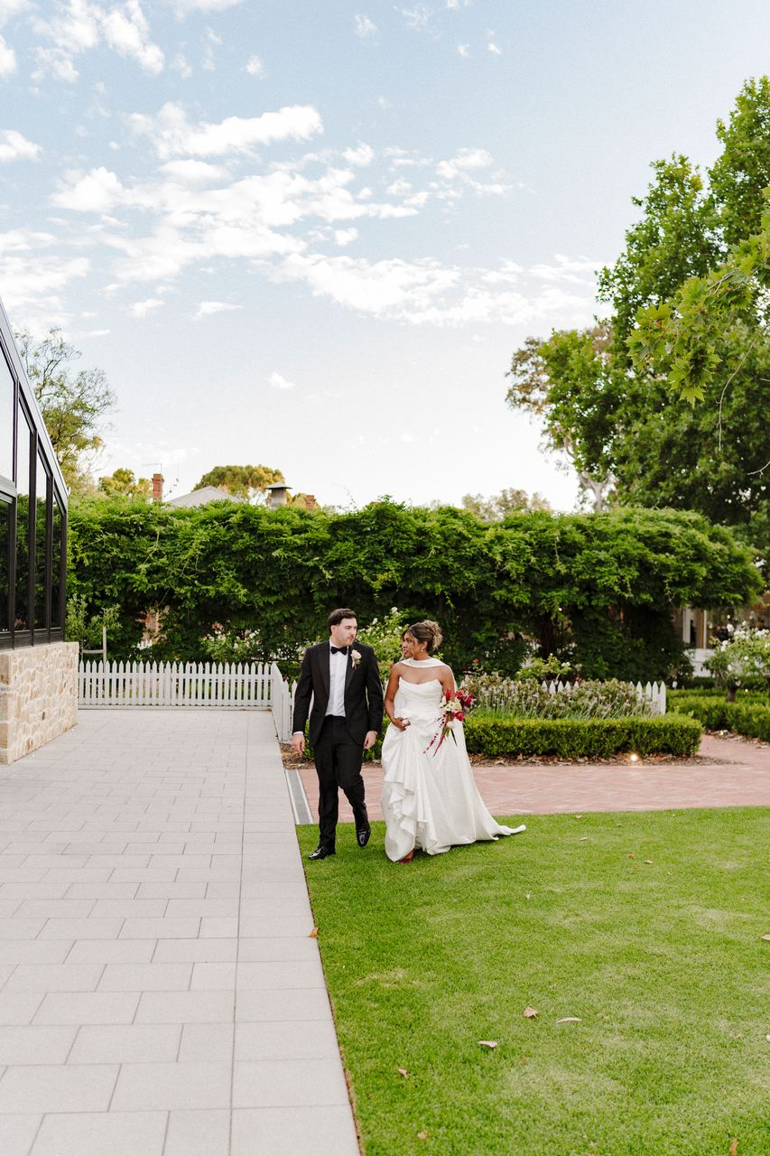 Ben and Sinead walking through the garden