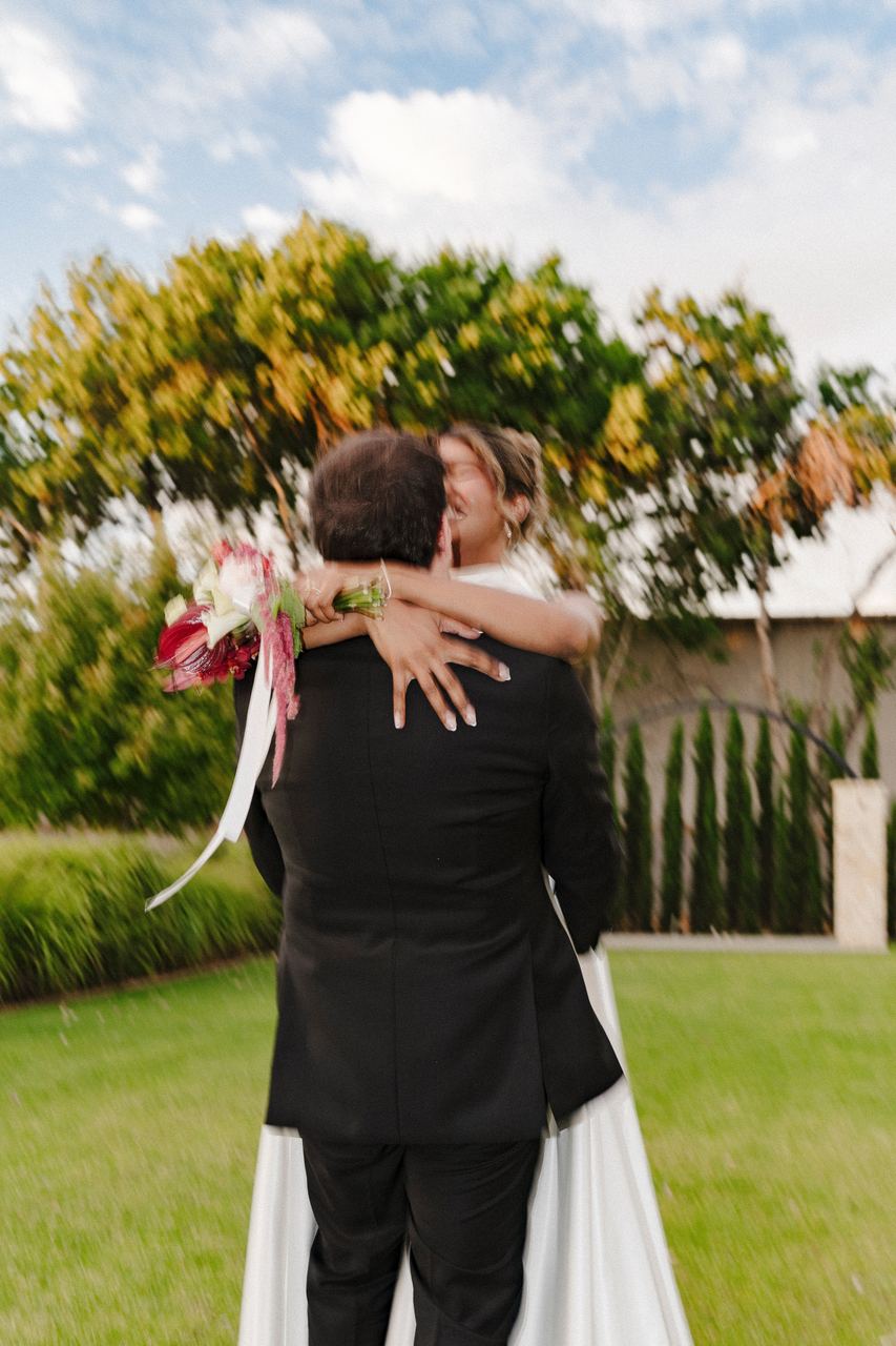 Ben lifting Sinead into a hug in the garden