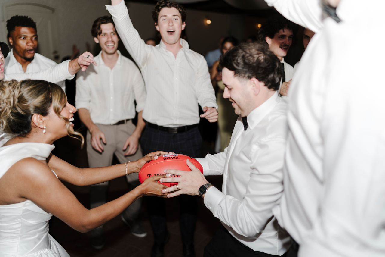 Ben and Sinead with friends and a football on the dance floor