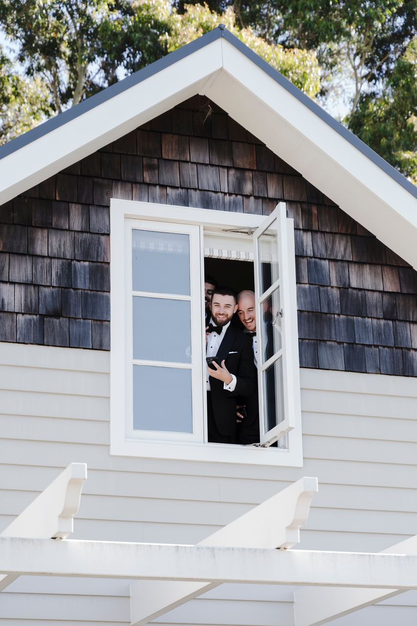 Matthew leaning out of the upstairs window