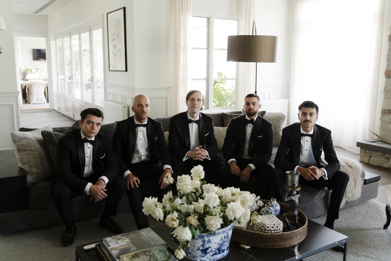 Matthew and the groomsmen gathered in the lounge