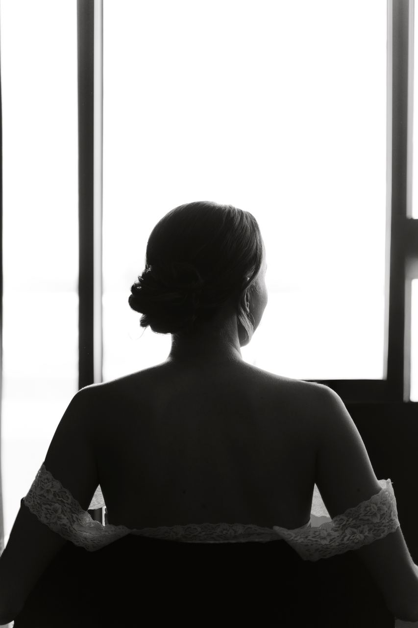 Alex silhouetted against the window