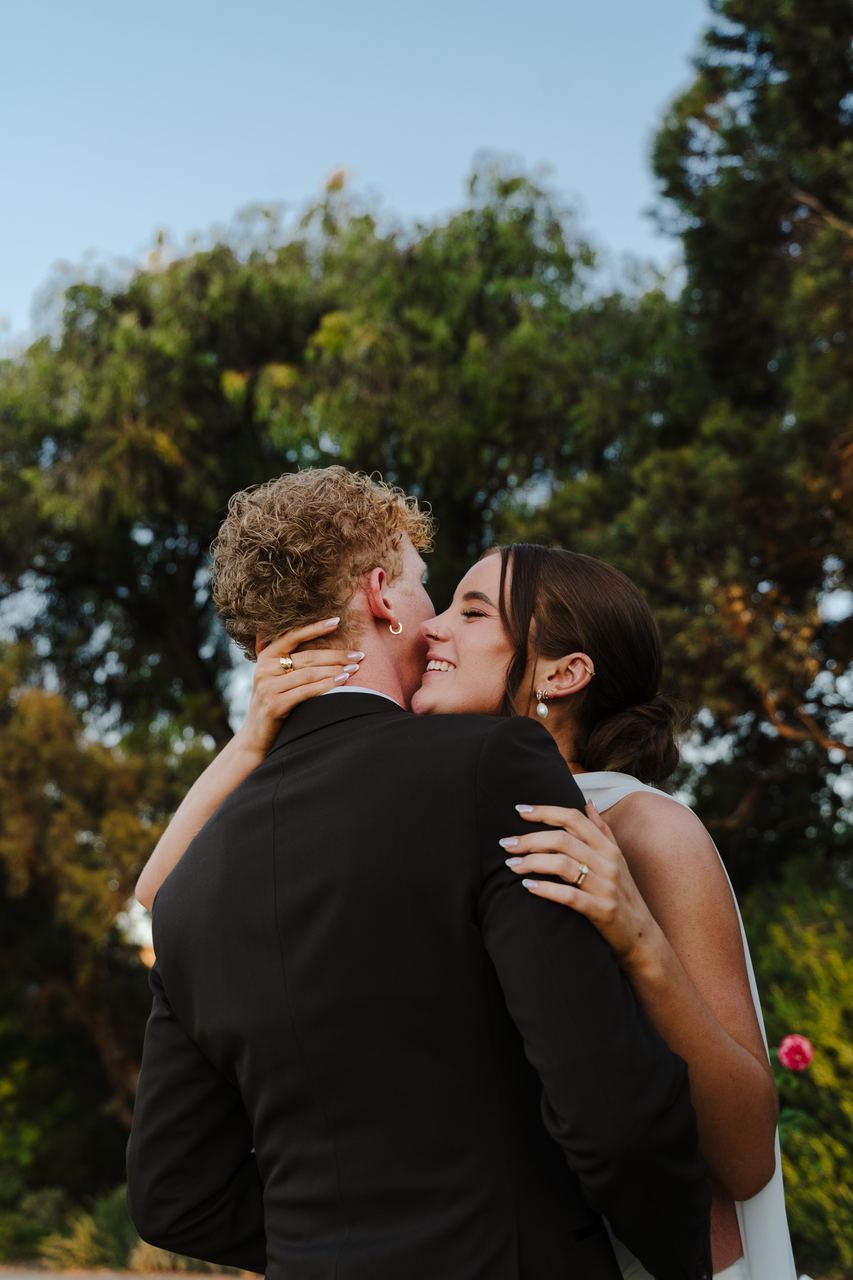 Emma and Liam kissing in the late afternoon light