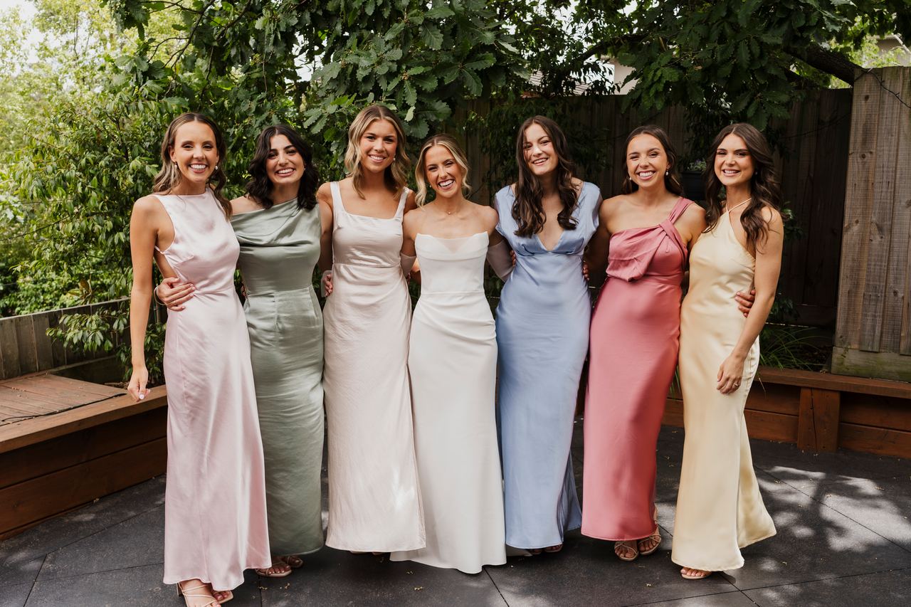 The bridesmaids in pastel satin