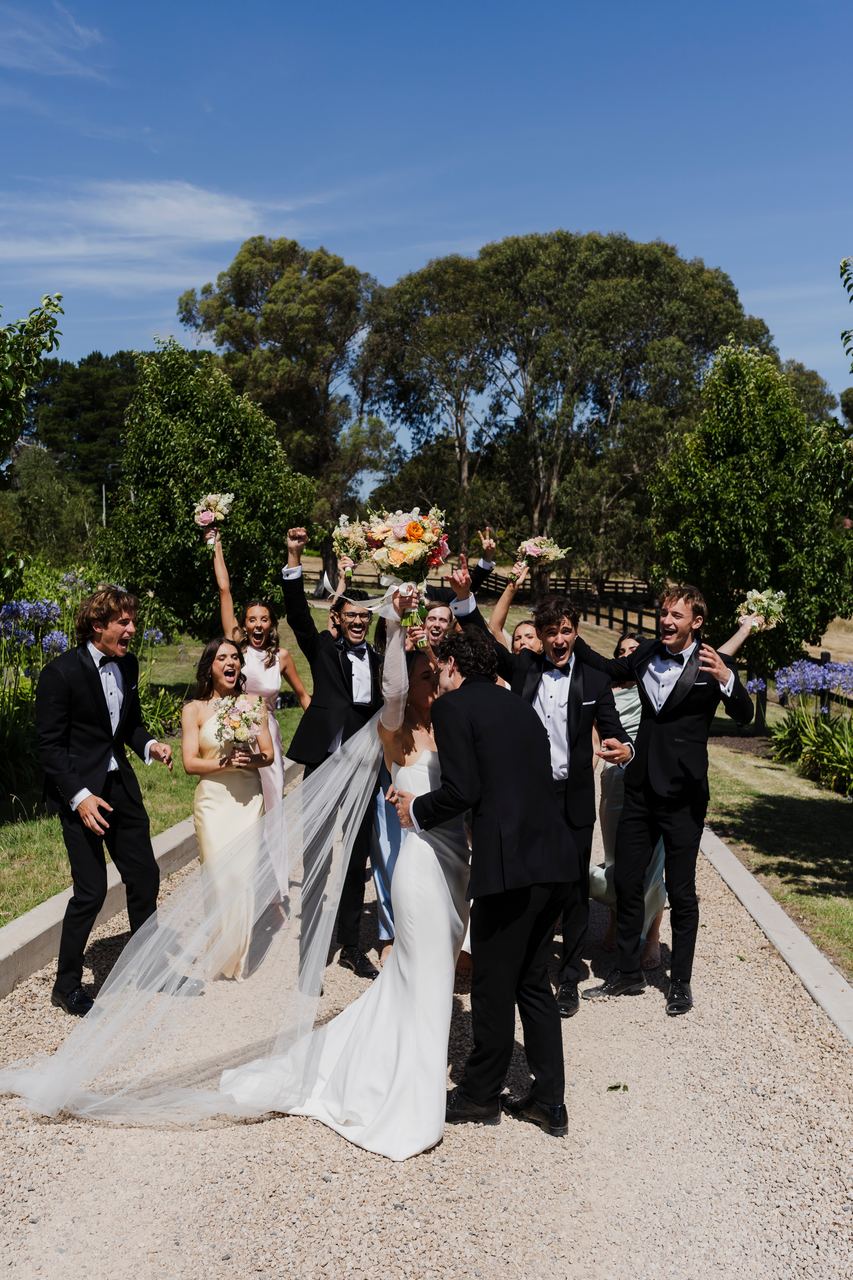 Guests cheering Caleb and Georgia out of the church