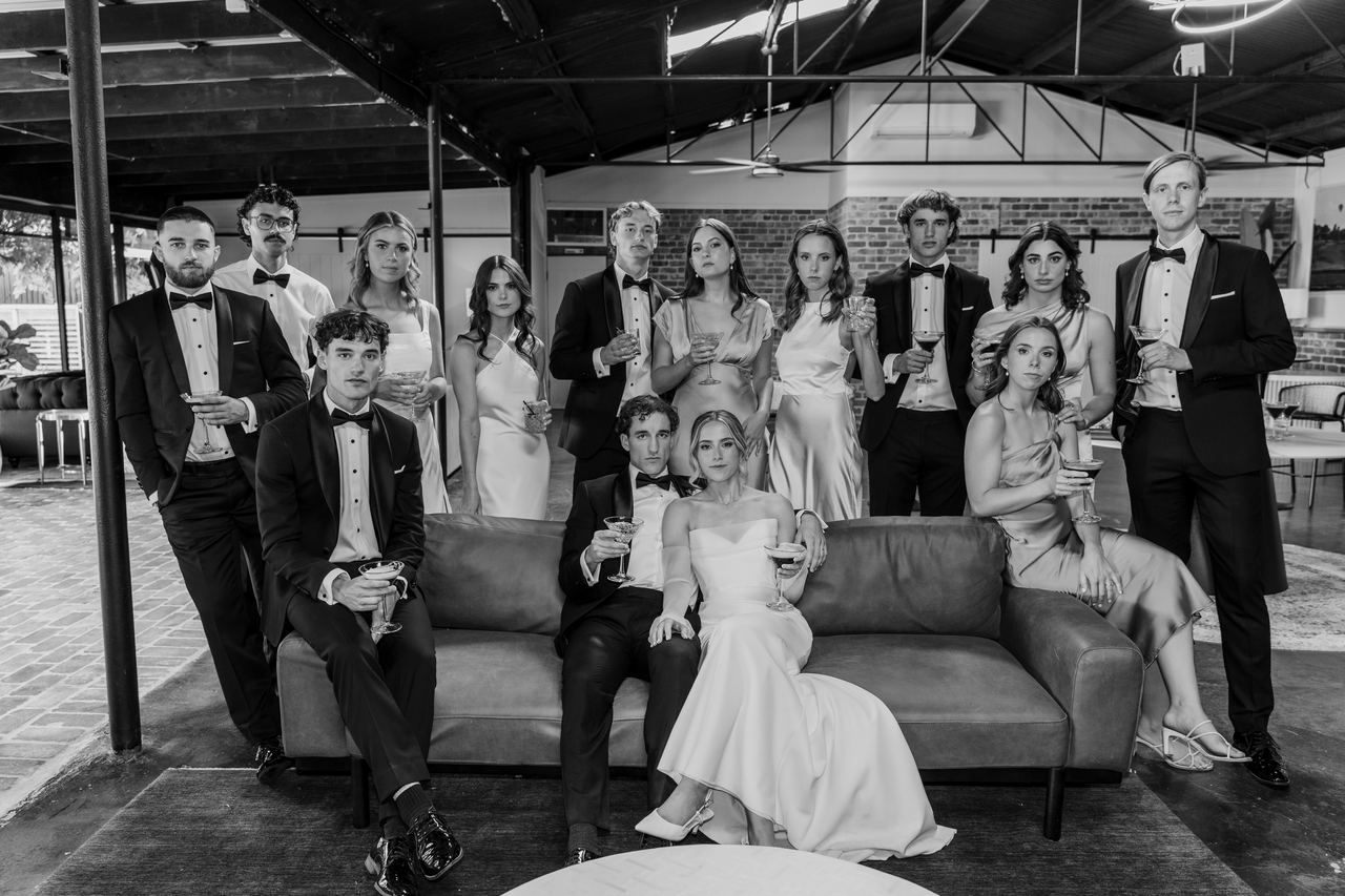 The wedding party gathered on the lounge