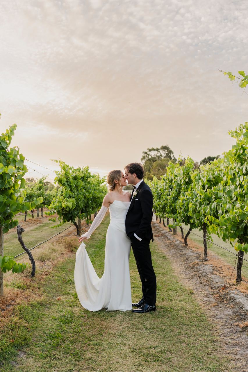 Caleb and Georgia in the vineyard at sunset