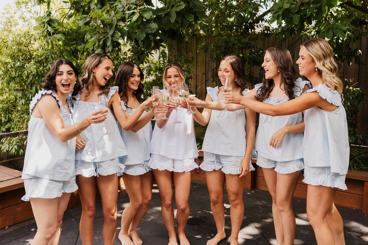 Georgia's bridesmaids raising a toast in the garden